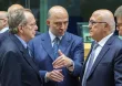Le ministre des Finances italien Pier Carlo Padoan, le commissaire européen à l'Economie Pierre Moscovici, et le ministre des Finances français Michel Sapin, à Bruxelles le 11 juillet 2015 - AFP/ JOHN MACDOUGALL


