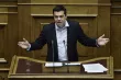 Le Premier ministre Alexis Tsipras dimanche devant le Parlement grec - AFP/ ANGELOS TZORTZINIS


