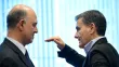 Le commissaire européen aux Affaires financières Pierre Moscovici (g) et le ministre grec des Finances Euclid Tsakalotos lors d'une réunion de l'eurogroupe à Luxembourg, le 21 juin 2018



