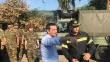 Le Premier ministre grec Alexis Tsipras (c) en déplacement sur les lieux d'un incendie meurtrier, le 30 juillet 2018 à Mati, à l'est d'Athènes


