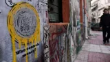 Un graffiti dans les rues d'Athènes le 4 février. Crédits photo : LOUISA GOULIAMAKI/AFP


