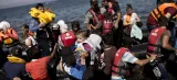 Des réfugiés syriens arrivent sur l'île grecque de Lesbos, le 11 septembre. Crédits photo : ANGELOS TZORTZINIS/AFP


