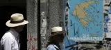 Les Grecs doivent rembourser près de 7 milliards d'euros en juillet. Crédits photo : Thanassis Stavrakis/AP


