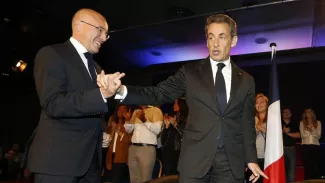 Grèce : après l'accord, la droite vante l'influence de Nicolas Sarkozy Éric Ciotti et Nicolas Sarkozy à Nice, le 21 octobre 2014. Crédits photo : VALERY HACHE/AFP