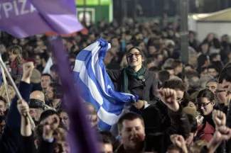 La victoire de la gauche radicale est elle une bonne nouvelle pour la démocratie européenne ou annonce-t-elle pauvreté et faillite publique? | AFP/LOUISA GOULIAMAKI



