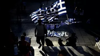 Des sympathisants de Syriza à Athènes, samedi 18 septembre. Crédits photo : ARIS MESSINIS/AFP


