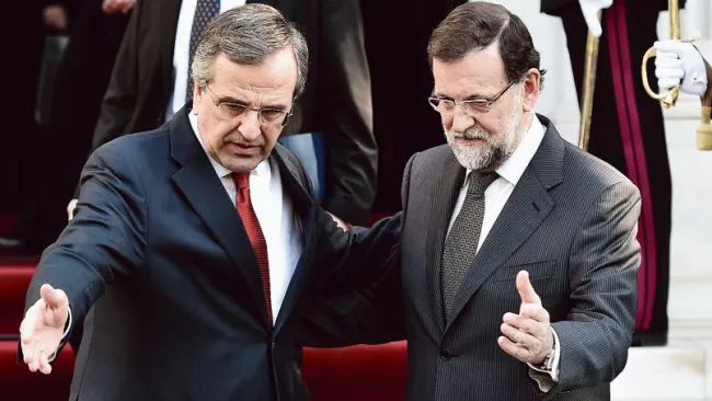 Les premiers ministres grec et espagnol, Antonis Samaras et Mariano Rajoy, lors de leur rencontre à Athènes, le 14 janvier Crédits photo : ARIS MESSINIS/AFP


