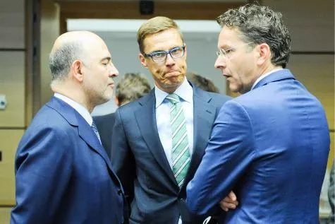 Pierre Moscovici (gauche), Alexander Stubb (centre) et Jeroen Dijsselbloem. © EPA


