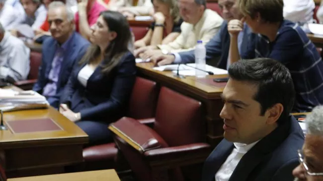Alexis Tsipras, mercredi, à l'Assemblée à Athènes, avant une réunion de son groupe parlementaire. Crédits photo : Petros Karadjias/AP


