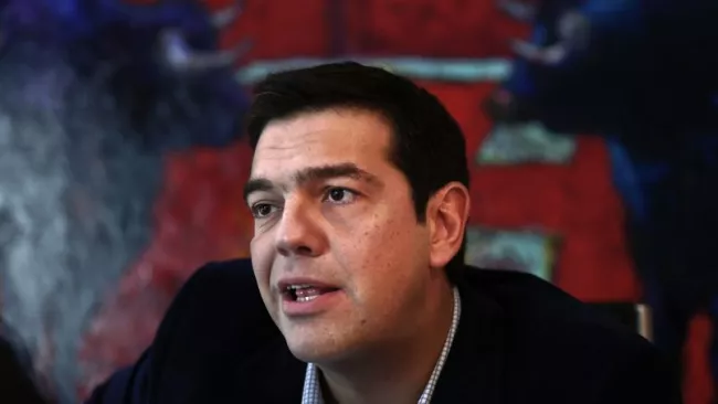 Alexis Tsipras, le dirigeant de la coalition Syriza, se présente désormais toujours en costume et chemise impeccables. Crédits photo : ALKIS KONSTANTINIDIS/REUTERS


