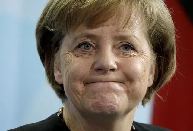 Sans doute à contre-c?ur, la chancelière a fini par adresser mardi ses félicitations à Alexis Tsipras qui a prêté serment dès lundi après-midi. Image: ARCHIVES/Keystone


