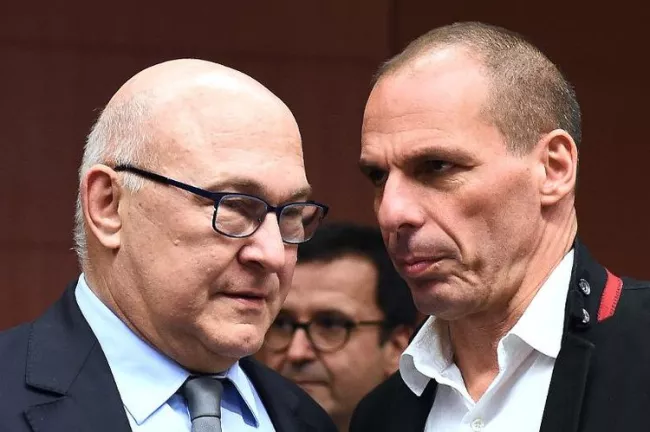 Les ministres français et grec des Finances, Michel Sapin et Yanis Varoufakis, le 20 février 2015, lors de la réunion de l'Eurogroupe à Bruxelles (Photo Emmanuel Dunand. AFP)


