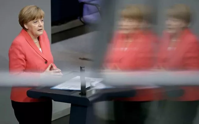 La chancelière allemande a mis en garde vendredi les députés allemands contre les risques de chaos qu'entraînerait un vote négatif du Bundestag sur l'ouverture de négociations pour l'octroi d'un troisième plan d'aide à Athènes - Sipa/Michael Sohn


