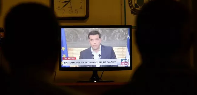 Alexis Tsipras annonçant sa démission lors d'une brève allocution télévisée le 20 août. (LOUISA GOULIAMAKI/AFP)


