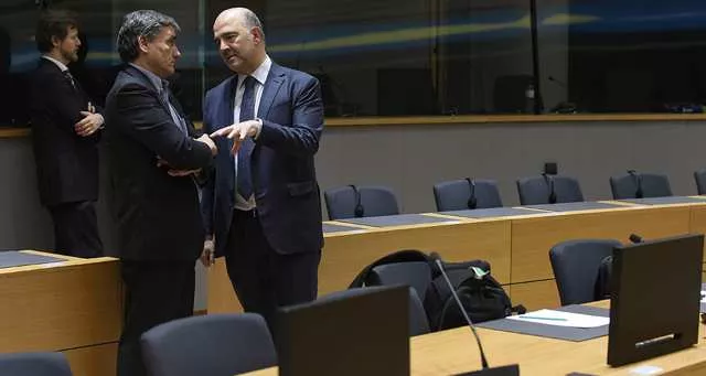 Euclide Tsakalotos, le ministre des Finances grec et le commissaire européen aux Affaires économiques, Pierre Moscovici à Bruxelles.


