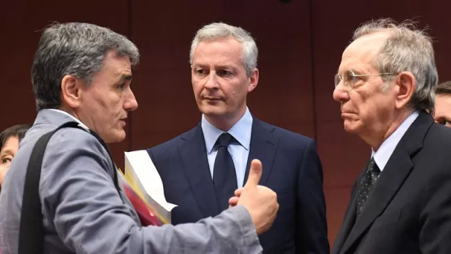 Le ministre des Finances grec Euclid Tsakalotos, le ministre de l'Economie français Bruno Le Maire, et le ministre des Finances italien Pier Carlo Padoan. Crédits photo : EMMANUEL DUNAND/AFP


