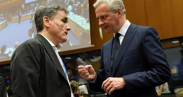 Euclide Tsakalotos, le ministre des Finances grec, et son homologue français, Bruno Le Maire, au Luxembourg. - Photo J. Thys/AFP



